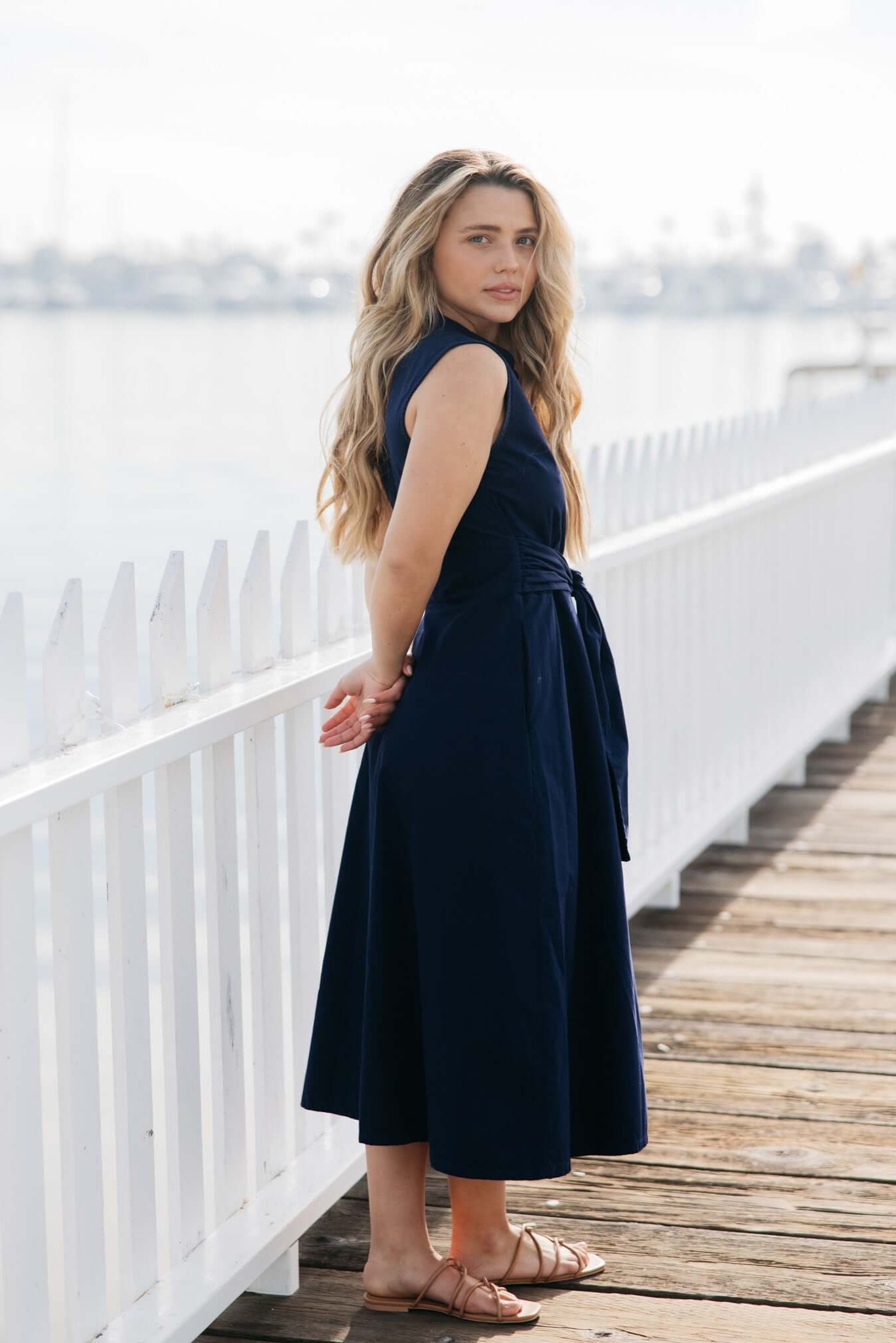Side view of Marilyn Midi Tie Dress in navy | Tie waist shirt dress with pockets | cotton